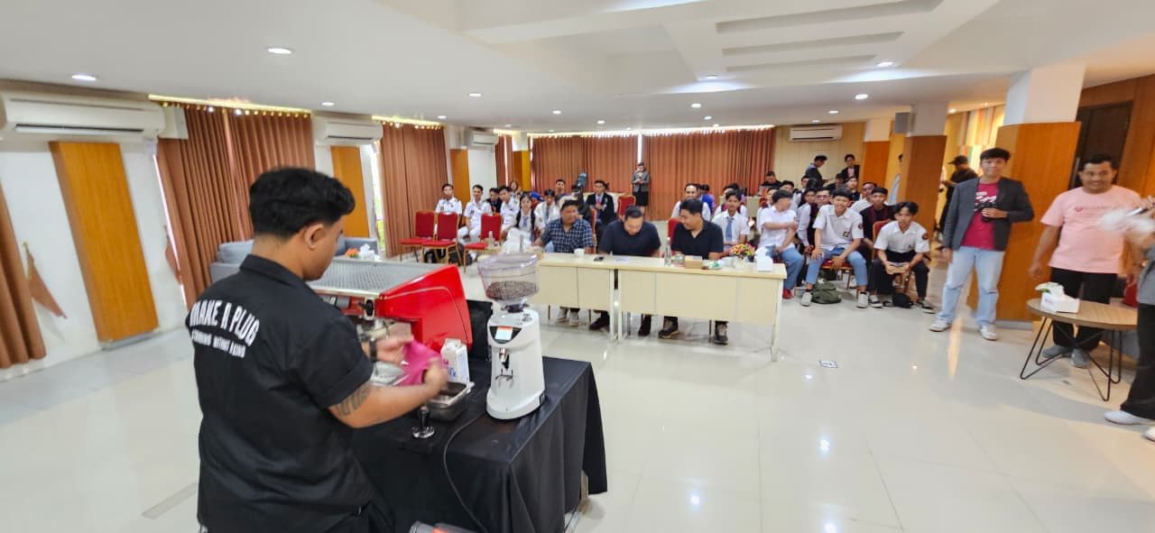 Barista demonstrating espresso preparation in front of participants